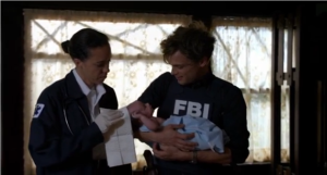 Matthew Gray Gubler as Spencer Reid holds the baby he just delivered.